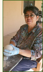 Pueblo woman making pottery.