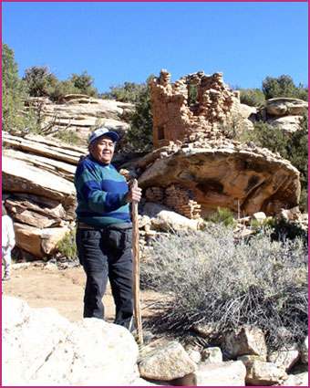 Pueblo man visiting an ancient Pueblo archaeological site in the Mesa Verde region.